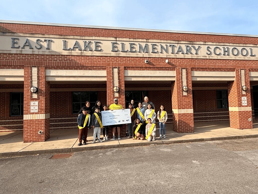 East Lake Elementary School students receive a check for their award winning STEM project