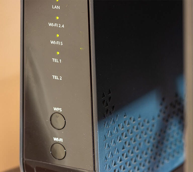 Black wireless router with WPS button