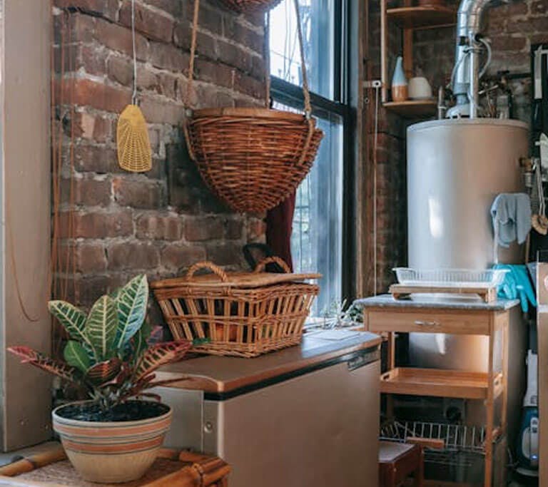 a storage tank water heater in a brick room