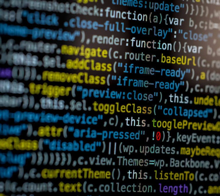 An extreme close-up of colorful programming code on a computer screen, showcasing development and software debugging.