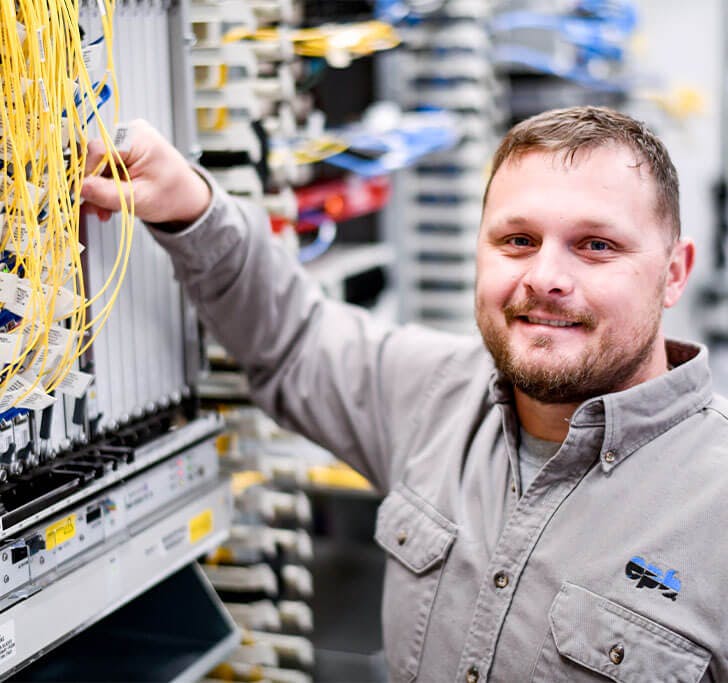 EPB Tech Pro working with fiber optic internet equipment.