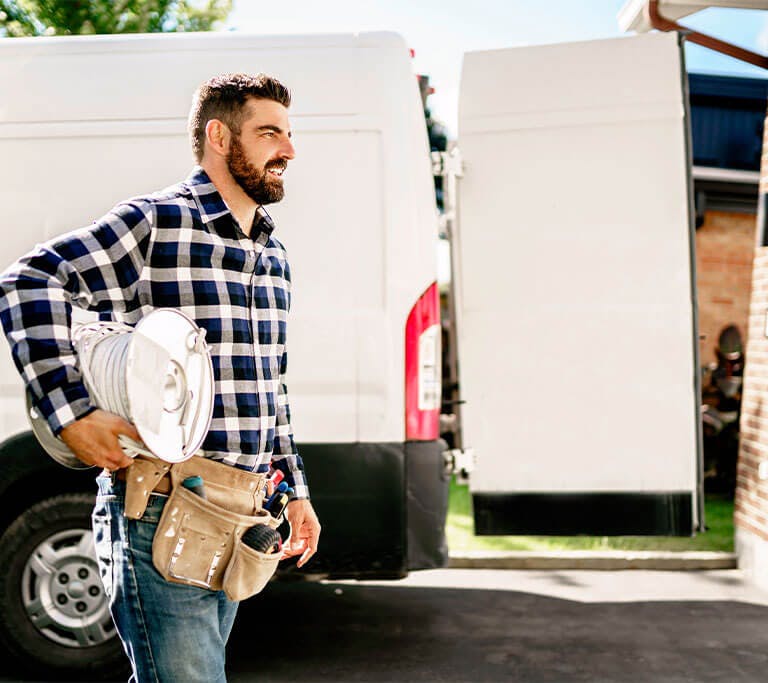 Portrait of a happy electrician at work