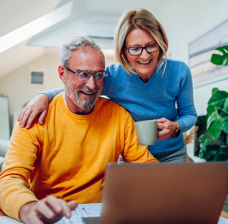 Man and woman looking at laptop