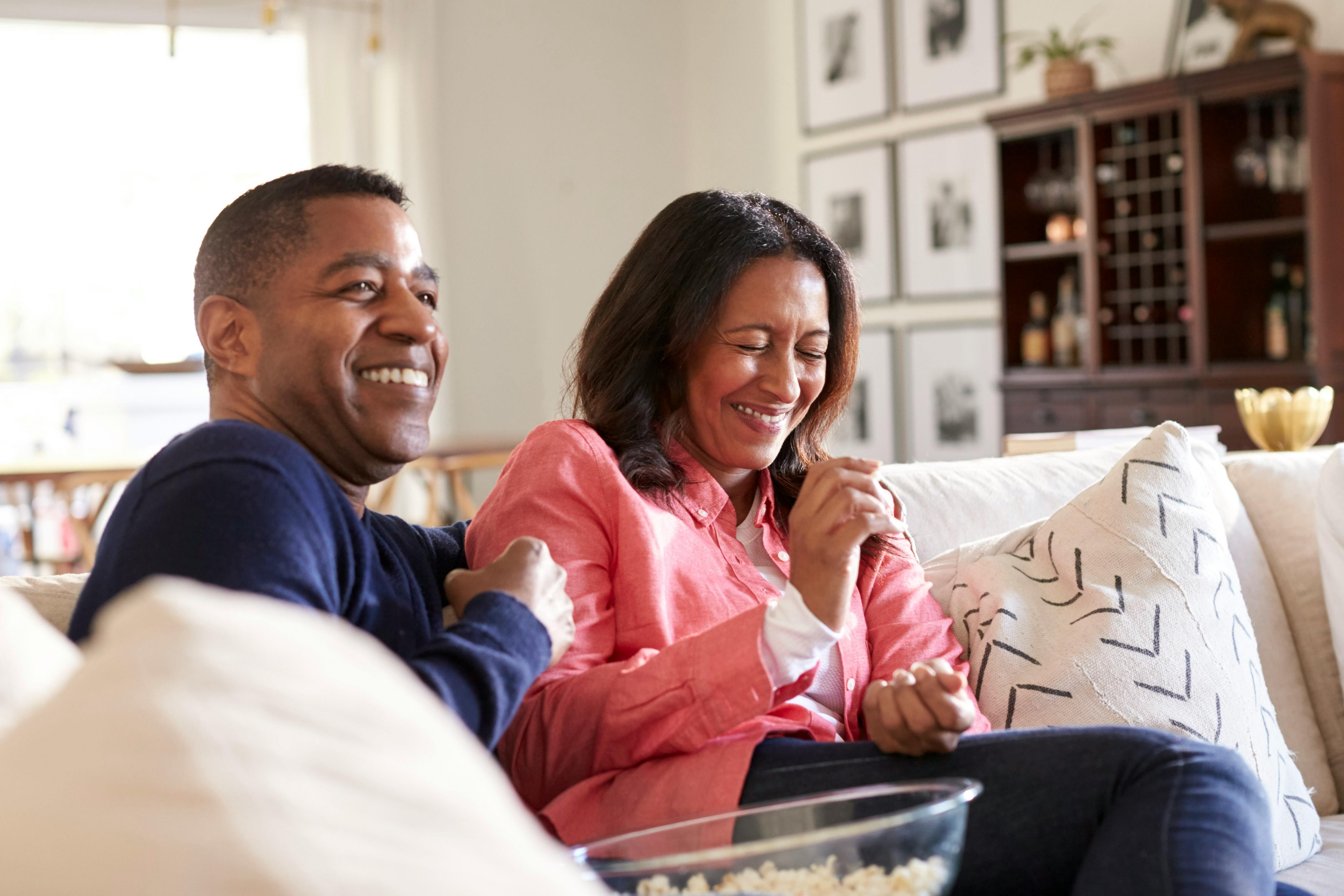 close-up-of-middle-aged-couple-sitting-on-the-sofa.jpg