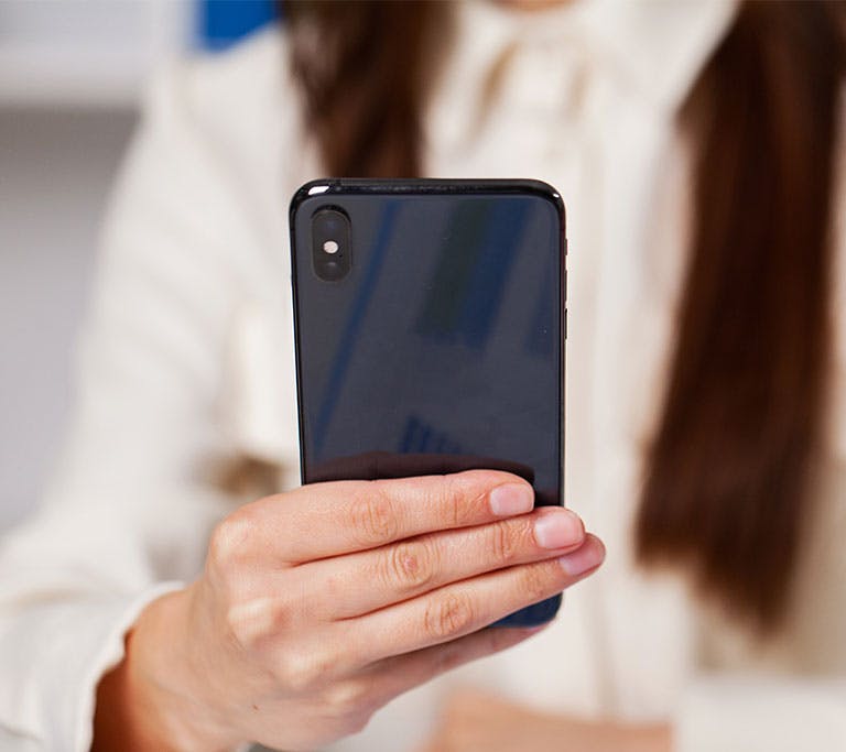 person holding iphone