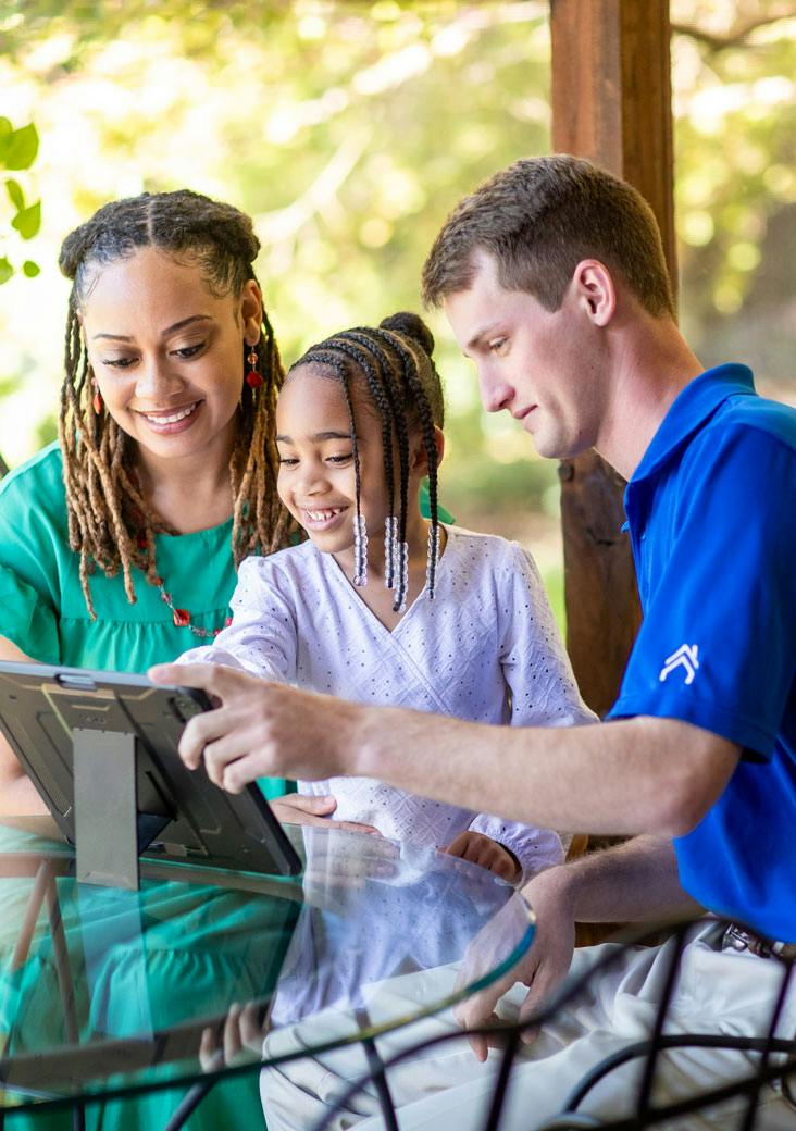 residential energy pro with mother and daughter looking at tablet