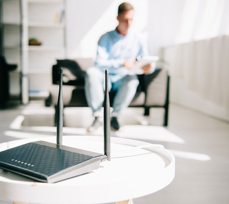 router on side table