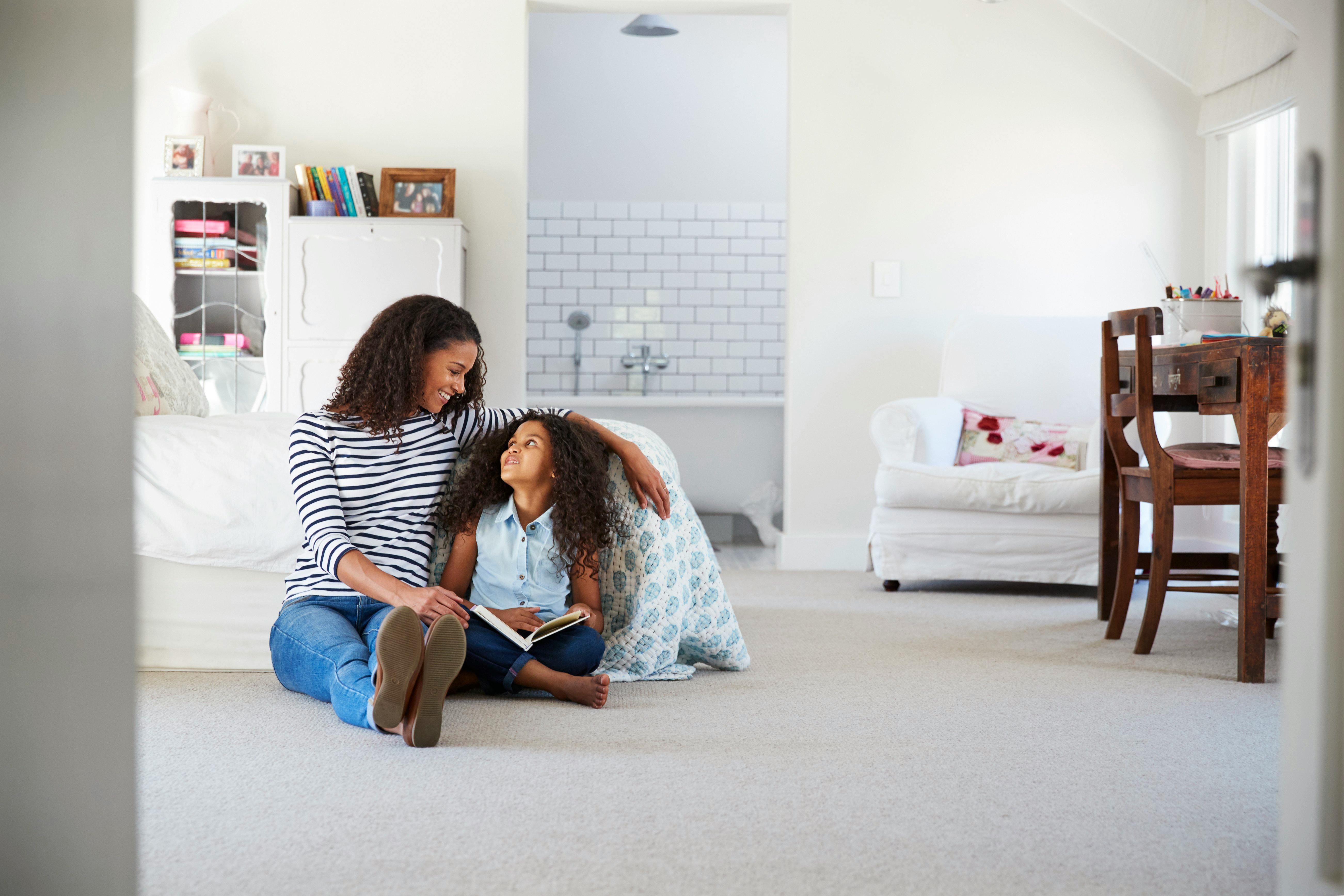 woman-and-girl-reading-a-book-together-indoors.jpg